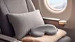 © Rupantar - First class airplane seat set up for relaxation with a travel pillow, eye