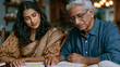 © Maksym - Indian family gathered around a dining table on the morning of a citizenship interview appointment, the parents reviewing printed preparation questions while their teenage daughter quizzes them calm