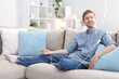 © New Africa - Man with IV drip on sofa at home