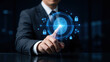 © Sasatron - Businessman touching a glowing blue fingerprint scanner with surrounding security icons