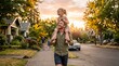 © Yuli - A happy father walking down a suburban sidewalk carrying his laughing young daughter on his shoulders during a warm sunset