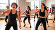 © Стивен Щиров - Diverse group of women enjoying a lively dance fitness class together