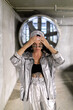 © Misha - Futuristic fashion portrait of a woman in metallic silver coat