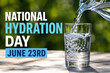 © Cornesia - National Hydration Day Concept with Water Pouring into Glass on Wooden Table