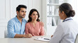 © Someone Cooked Here - premium fertility clinic consultation with indian couple and experienced female doctor for reproductive healthcare and baby planning concept