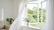 © Masque - An open window with sheer curtains flowing in the breeze for natural ventilation.