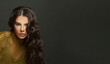 © millaf (Nemchinova) - Posing brunette woman with long healthy hair on dark background