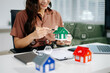 © Nuttapong punna - Considering buying a home, investing in real estate. Broker signs a sales agreement. agent, lease agreement, successful deal
