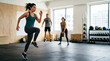 © Xenia - Group of people doing HIIT workout in gym. Fitness and weight loss training concept