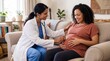 © NORN - Pregnancy Check-up at Home: A compassionate doctor performs a gentle check-up on a smiling pregnant woman, using a stethoscope to listen to the baby's heartbeat in a cozy home environment.