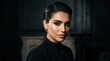 © Wattana - A woman with dark hair and makeup, wearing a black outfit, standing in a dimly lit room with a dark background.