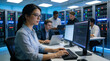 © JohnLee - Young coder working at desktop workstation indoors