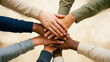 © Enes - Diverse hands of different skin tones stacked together in team unity, diversity inclusion concept, multicultural workplace, team collaboration unity, equality workforce, inclusive business