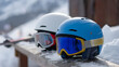 © photo for everything - Two Vibrant Ski Helmets with Goggles Rest on a Snowy Bench, Winter Sports Gear Ready for Mountain Adventure and Safety on the Slopes