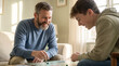 © SuperImages - Smiling mature father and teenage son playing indoor board game