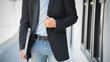 © Laingzaifa - Confident businessman standing outdoors using smartphone, communicating professionally, enjoying urban lifestyle, digital connectivity, leadership, career success, and modern corporate innovation.