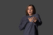© Pixel-Shot - Young woman having panic attack on dark background