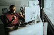 © BGStock72 - Person in office enjoys success while using computer at work during the day
