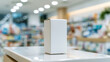© pattozher - Blank Product Packaging: A pristine white box sits on a polished counter, ready to be filled with a product. The blurred background of a store suggests it's a retail environment.