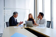 © krongthip - A man and a woman are working together in an office.
