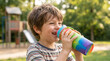 © Vong-7432 - Young Boy Staying Hydrated with Reusable Water Bottle