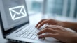 © Anca - Typing email on a laptop with a glowing envelope icon displayed on the screen, highlighting digital communication. ..Created with Generative AI, not depicting real subjects.