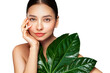 © Oleg Gekman - Close up woman face with green exotic leaf. Skin care beauty treatments concept. Model with clean, health skin of face