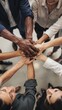 © theo - Diverse hands together team unity