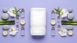 © Edina - A serene spa setting with a neatly folded white towel at its center, surrounded by smooth stones, delicate orchid blossoms, bamboo stalks, small bottles of essential oil, and lit candles.