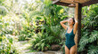 © Valentina Sorokina - Young woman enjoying tropical outdoor shower during a carefree summer escape in paradise. Relaxed lifestyle scene about youthful freedom, self care and unforgettable vacation moments