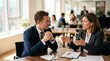 © Ada - Meeting and presentation at the desk. Close-up of corporate job interview with two professionals in office, woman gesturing with pen while man listens.