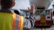 © A2Z AI  - Ground Crew Worker Direct Aircraft Movement on Tarmac, Providing Essential Guidance for Safe Operations and Logistics at the Airport