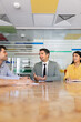 © fizkes - Adult businessman leading discussion, sharing solution, presenting ideas, consulting clients, or planning strategic business decisions with diverse team during corporate meeting in conference room