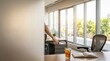 © SimpleDesignStudio - Professional office workspace with iced tea and open notebook near sunny window with blurred person reaching for drawer