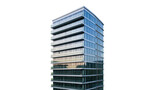 Isolated modern residential building with glass facade and balconies, contemporary architecture.