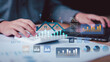 © chaylek - Real estate analysts monitor property market trends through housing analytics dashboards, investment forecasting, financial reporting, growth metrics, and real estate performance tracking.