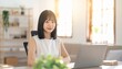 © yohaku - デスクでノートPCと働く日本人女性ビジネスシーン