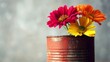 © JPminimal - Rusty metal can filled with colorful flowers indoor setting close-up shot vibrant nature display