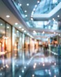 © morepiixel - Blurred interior of a modern shopping mall with bright lights and reflective floors creating a spacious and vibrant atmosphere.