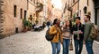 © velikiyzayats - Diverse group of young adult friends exploring a historic European city street with a map, smiling and laughing while traveling together on a summer vacation trip