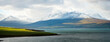© Cavan Images - Snow capped mountains lakes and green pastures of Iceland