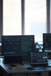 © DragonImages - Vertical shot of cybersecurity workstation displaying network analytics, code monitoring, data dashboard on multiple screens. Supporting IT operation, threat detection, enterprise technology marketing