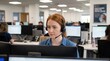 © Yauhen - A professional woman with red hair wearing a headset looks at a computer screen in a busy call center. The atmosphere is focused and professional. Ideal for customer service or business themes.