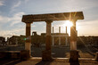 © 9parusnikov - Sunbeams shining through an ancient stone archway in Pompeii