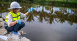 © reewungjunerr - Environmental engineers inspect water quality,Bring water to the lab for testing,Check the mineral content in water and soil,Check for contaminants in water sources.