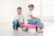 © New Africa - Little children with toy car at home