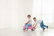 © New Africa - Little children with toy car at home, space for text