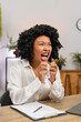 © Andrii Iemelianenko - African American businesswoman at home office reviews documents spots error crumples paper frustrated tossing it aside. Freelancer girl at table sighs upset plans correction before submitting file up.