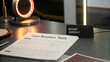© Finasulizi - Business Loan Recovery Process with Table Report and Reminder Sign on Office Desk for Financial Institutions and Recovery Strategies