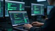 © Desmon - Cybersecurity Analyst Typing Code on Laptop in Dark Server Room